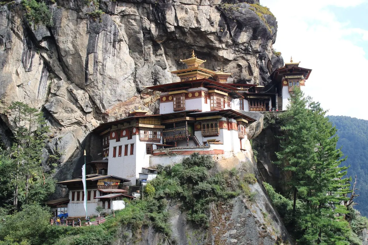 Scenic view of Tiger's Nest Monastery nestled on a cliff in Bhutan's Himalayas.